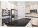 Close up on kitchen island and stainless fridge, oven and microwave at 646 Quicksilver Trl # 183, Fort Mill, SC 29708