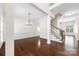 Expansive living room featuring hardwood floors, decorative wainscotting and an elegant staircase at 646 Quicksilver Trl # 183, Fort Mill, SC 29708