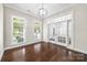 Sunlit office with hardwood floors, large windows, modern lighting, and a pair of French doors at 646 Quicksilver Trl # 183, Fort Mill, SC 29708