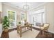 Inviting office space featuring hardwood floors, a desk, chair, and bright light from large windows at 646 Quicksilver Trl # 183, Fort Mill, SC 29708