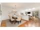 Elegant dining room with a chandelier, hardwood floors, and open layout at 6602 Gaywind Dr, Charlotte, NC 28226