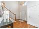 Welcoming foyer with hardwood floors, a staircase, and natural light at 6602 Gaywind Dr, Charlotte, NC 28226