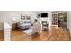 Cozy living room with hardwood floors, fireplace, and natural lighting at 6602 Gaywind Dr, Charlotte, NC 28226