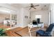 Office space featuring hardwood floors, a ceiling fan, and glass-paned French doors at 6602 Gaywind Dr, Charlotte, NC 28226