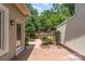 Brick patio surrounded by lush landscaping, offering a private outdoor space at 6602 Gaywind Dr, Charlotte, NC 28226