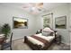 Comfortable bedroom features neutral walls, soft carpet, and warm, inviting decor at 703 Dalebrook Ln, Rock Hill, SC 29730