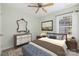 Comfortable bedroom with a window view, neutral walls and a wooden bedframe at 703 Dalebrook Ln, Rock Hill, SC 29730