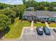 Aerial view of the home with a well-manicured front lawn and convenient parking at 703 Dalebrook Ln, Rock Hill, SC 29730