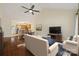 Open-concept living room with hardwood floors, vaulted ceilings, and an adjacent modern kitchen at 703 Dalebrook Ln, Rock Hill, SC 29730
