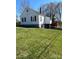 Back exterior featuring a well-maintained lawn and a deck, ideal for entertaining at 706 13Th Sw St, Hickory, NC 28602