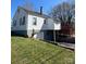 Back exterior view of home with deck, partial basement access, and landscaped backyard at 706 13Th Sw St, Hickory, NC 28602