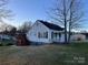 Charming home featuring a cozy front porch, a new deck, and a well-maintained lawn at 706 13Th Sw St, Hickory, NC 28602