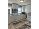 Well-lit kitchen features white cabinets, stainless steel appliances, tile backsplash, and updated countertops at 706 13Th Sw St, Hickory, NC 28602