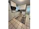 Well-lit kitchen features white cabinets, stainless steel appliances, tile backsplash, and updated countertops at 706 13Th Sw St, Hickory, NC 28602