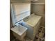 Bright laundry space with modern washer, dryer, a sink, and tile floors at 706 13Th Sw St, Hickory, NC 28602