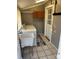 Functional laundry room area complete with washer, dryer, sink, and cabinetry for storage at 706 13Th Sw St, Hickory, NC 28602