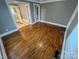 Inviting living room featuring gleaming hardwood floors, neutral paint, and multiple entry ways at 706 13Th Sw St, Hickory, NC 28602