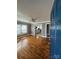 Inviting living room featuring gleaming hardwood floors, neutral paint, and an open doorway to the kitchen at 706 13Th Sw St, Hickory, NC 28602