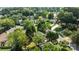 Home in a leafy neighborhood, showcasing mature trees and green spaces at 7219 Spring Morning Ln, Charlotte, NC 28227