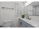Modern bathroom featuring sleek vanity with stylish faucet and tile shower at 7219 Spring Morning Ln, Charlotte, NC 28227