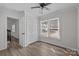 Sunlit bedroom with closet, windows, and views to the stairway at 7219 Spring Morning Ln, Charlotte, NC 28227
