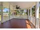 Large covered deck featuring sturdy white support columns and railings, offering scenic backyard views at 7219 Spring Morning Ln, Charlotte, NC 28227