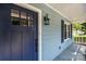 Charming home featuring a blue front door, blue shutters, and a porch at 7219 Spring Morning Ln, Charlotte, NC 28227