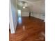 Finished attic featuring hardwood floors and built-in storage under the eaves at 743 S College Ave, Newton, NC 28658