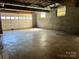 Unfinished basement with garage door at 743 S College Ave, Newton, NC 28658