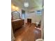 A bathroom featuring a vintage-style sink vanity, a toilet, and a window for natural light at 743 S College Ave, Newton, NC 28658
