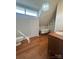 Bathroom featuring a clawfoot tub, wooden vanity, toilet and dormer windows at 743 S College Ave, Newton, NC 28658
