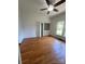View of a bedroom featuring hardwood floors, light colored walls and built-in shelving at 743 S College Ave, Newton, NC 28658