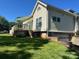 Rear of a two-story home with a wooden deck and lower level garage at 743 S College Ave, Newton, NC 28658