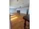 Living room with hardwood floors, fireplace, and beadboard walls at 743 S College Ave, Newton, NC 28658