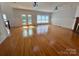 Living room with hardwood flooring, fireplace, and French doors at 743 S College Ave, Newton, NC 28658