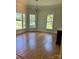 View of a living room featuring hardwood floors, light colored walls and large windows at 743 S College Ave, Newton, NC 28658