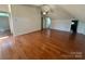 Spacious room featuring hardwood floors and a ceiling fan at 743 S College Ave, Newton, NC 28658