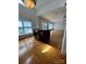 Bright living area with hardwood flooring, island bar, and large windows at 743 S College Ave, Newton, NC 28658
