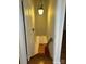 View of a wood staircase with an overhead pendant light fixture at 743 S College Ave, Newton, NC 28658