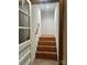 View of a wooden staircase with handrail at 743 S College Ave, Newton, NC 28658