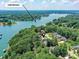 Stunning aerial view of Lake Norman homes nestled among lush trees with waterfront access and serene surroundings at 7717 Nautical View Dr, Denver, NC 28037