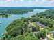 Beautiful aerial view of Lake Norman homes with lush trees, waterfront access, and a serene residential neighborhood at 7717 Nautical View Dr, Denver, NC 28037