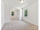 Bedroom with neutral carpeting, large windows providing lots of natural light, and neutral paint at 7717 Nautical View Dr, Denver, NC 28037