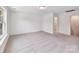 Spacious bedroom with plenty of natural light and plush carpeting at 7717 Nautical View Dr, Denver, NC 28037