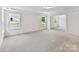 Expansive bedroom featuring recessed lights, tray ceiling, and windows providing natural light to the space at 7717 Nautical View Dr, Denver, NC 28037