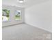 Inviting bedroom with large windows providing scenic views and natural light, creating a serene retreat at 7717 Nautical View Dr, Denver, NC 28037