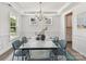 Dining room showcasing stylish furnishings and architectural details, with access to the kitchen at 7717 Nautical View Dr, Denver, NC 28037