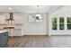 Open-concept kitchen featuring an island, modern appliances, and a view to the breakfast nook at 7717 Nautical View Dr, Denver, NC 28037