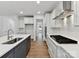 Spacious kitchen area with white cabinets, stainless steel appliances, and a subway tile backsplash at 7717 Nautical View Dr, Denver, NC 28037