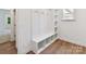 Functional mudroom with built-in bench, coat hooks, and storage shelves for organization at 7717 Nautical View Dr, Denver, NC 28037